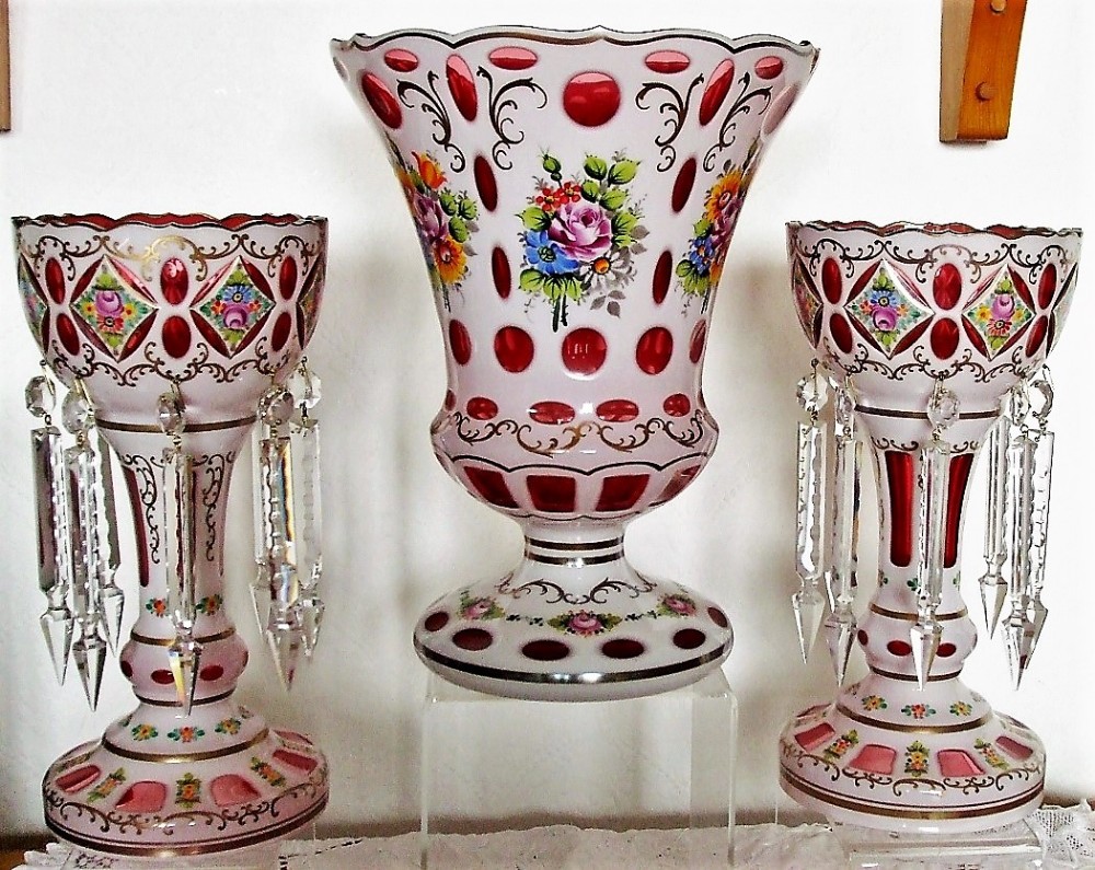 garniture of bohemian overlay and enamelled glass lustres and vase
