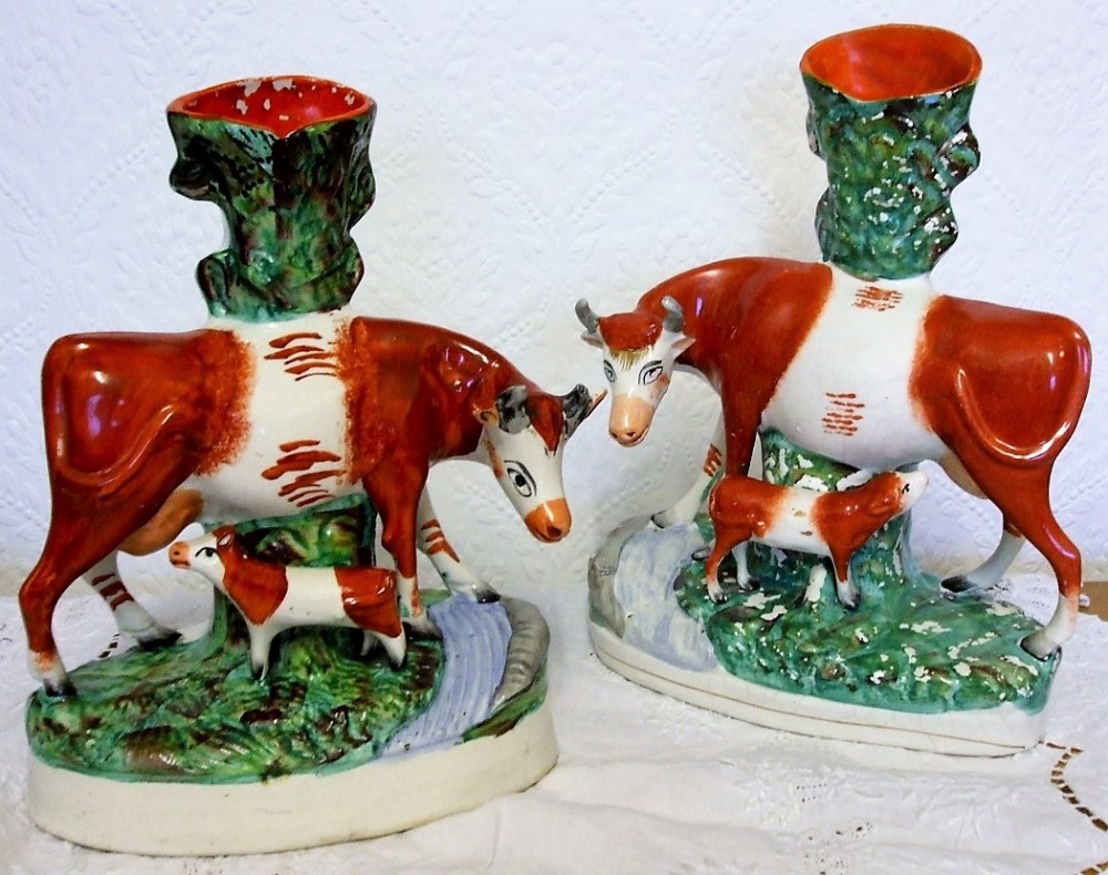 pair of antique english victorian staffordshire cow and calf pottery spill vases h 2893 h 2894