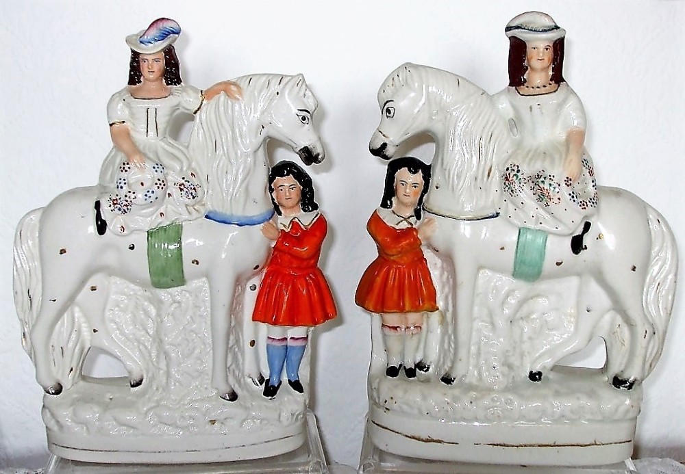 pair of victorian staffordshire figures children with horses h 2377 h 2378