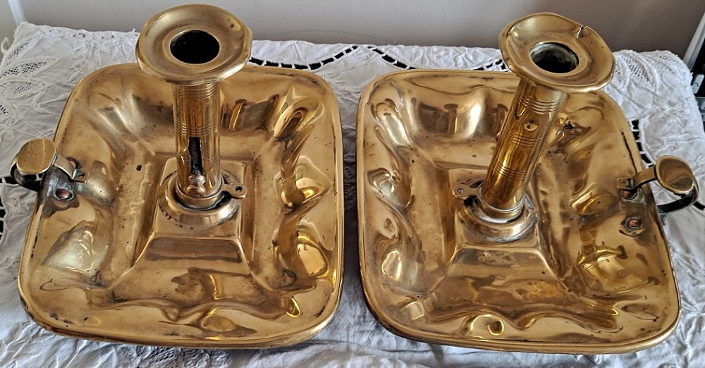 pair of antique english georgian brass chambersticks